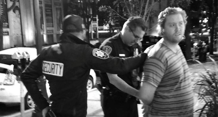 Brandon Reisdorf being arrested